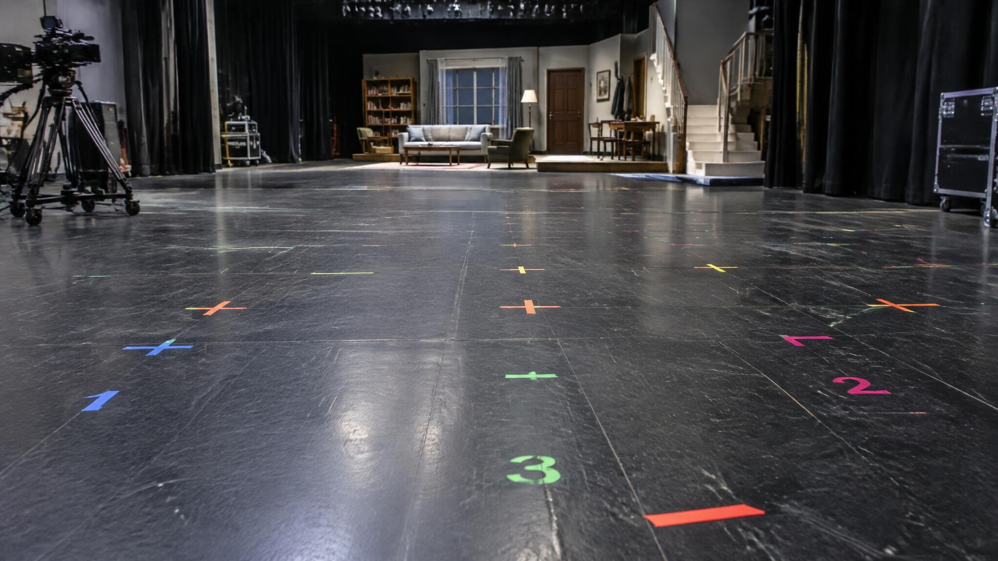 Floor markings and camera position tape marks on a stage floor